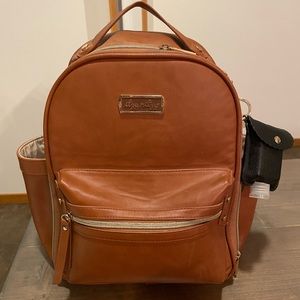 Itzy ritzy mini diaper bag. Includes hand sanitizer holder accessory